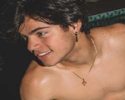 He always wears a cross on his neck which shows he is religious-minded.